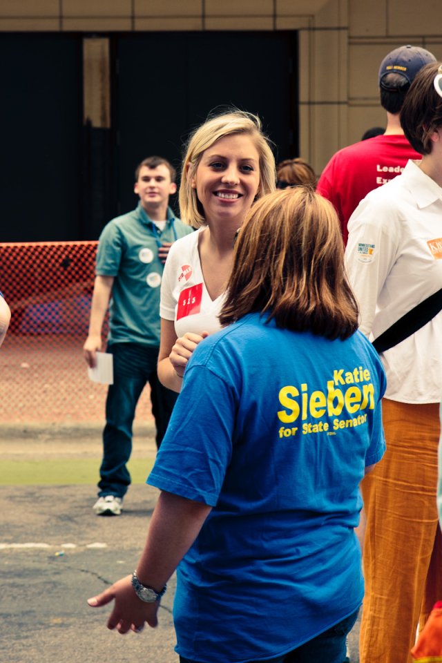Rep. Carly Melin talks with former Rep. Karla Bigham at Twin Cities Pride.